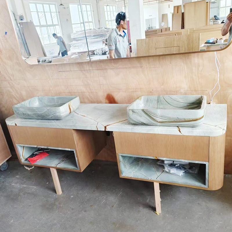 How can natural granite furniture countertops be used in the kitchen to prevent oil stains from penetrating?